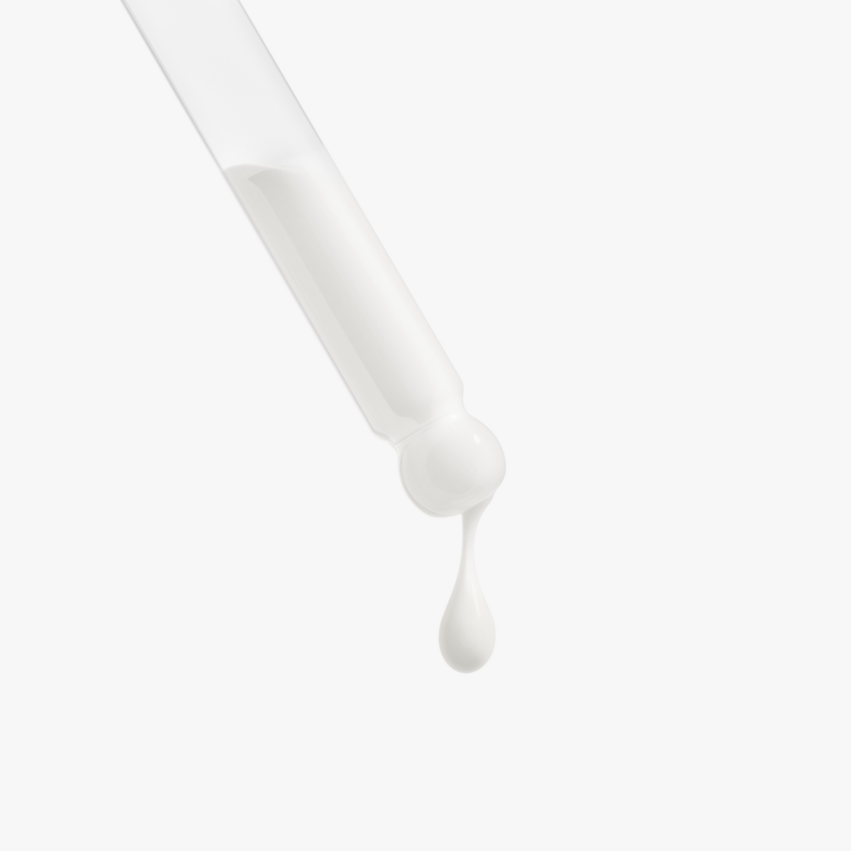Close-up of Retinol and Peptide Face Serum dropping from the dropper