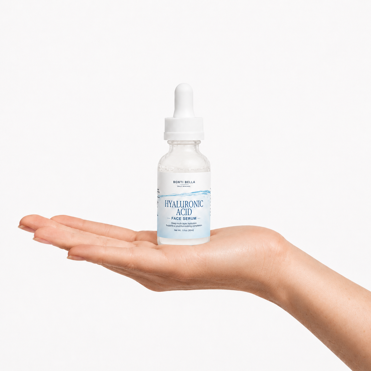 Hand holding Bonti Bella Hyaluronic Acid Serum bottle